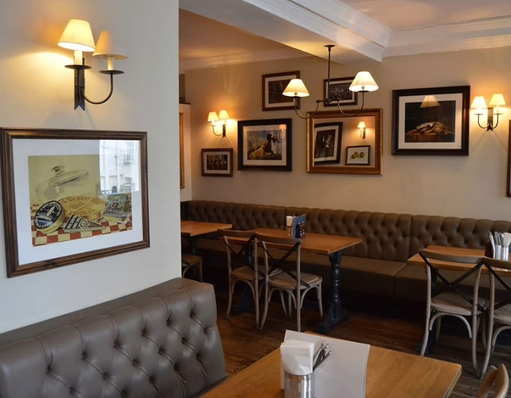 Internally shot of tables and seating at The Salamander pub,  Bath